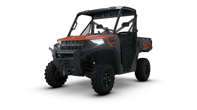 A 2026 Polaris® Ranger 1000 Premium with glass windshield and rear windscreen, red and black exterior, rugged tires, and front bumper is displayed from a front-side angle—win it in Raffle #681 with tax and tags included.